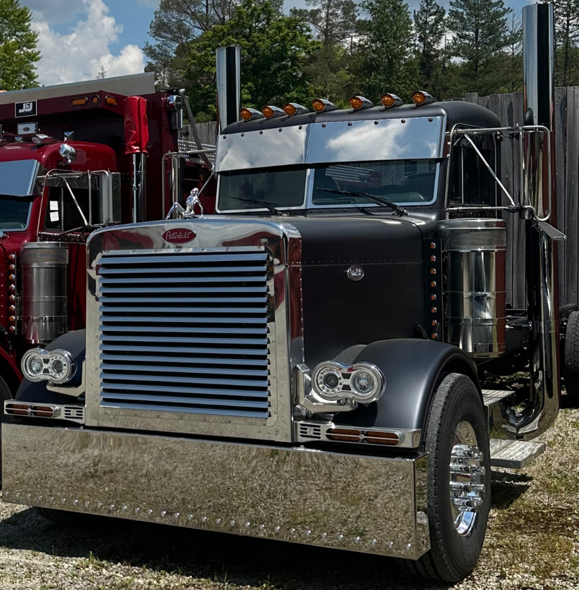 Roc Heavy Haul's black Peterbilt truck parked at the yard